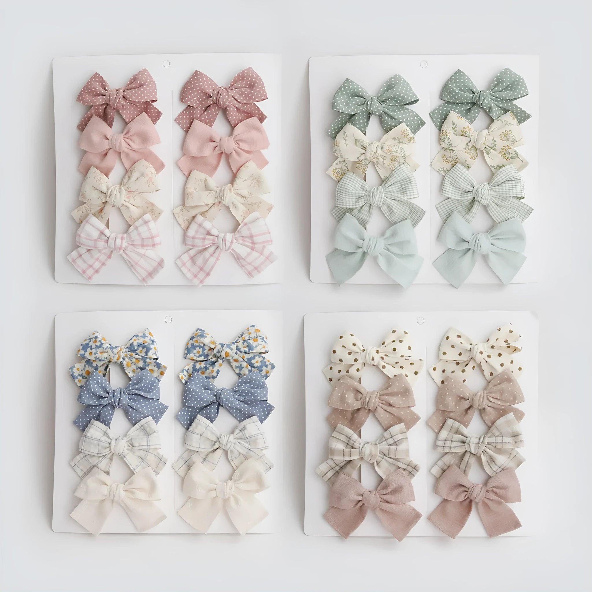 Children's fabric dovetail bow hairclips set showing multiple colour and pattern options