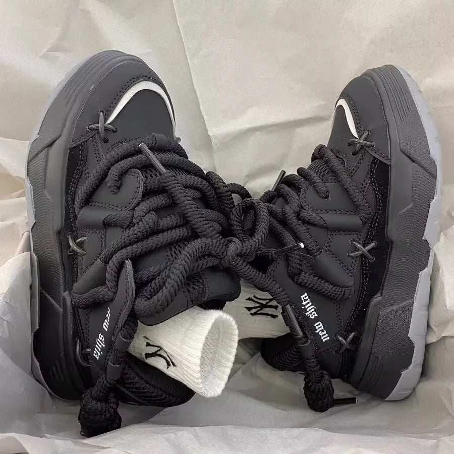Women's grey retro chunky sneakers with thick rubber platform sole and lace-up front.