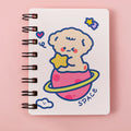 Astronaut-themed pocket flipper notebook showing compact 10.5cm by 8cm dimensions with flip-style binding