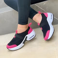 Women's white mesh flat sneakers with a round toe and rubber sole, shown alongside black, blue, and pink colour options.