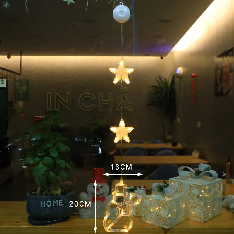 Set of three battery-powered LED Christmas pendant lights with suction cups, showing star, tree, and deer designs.
