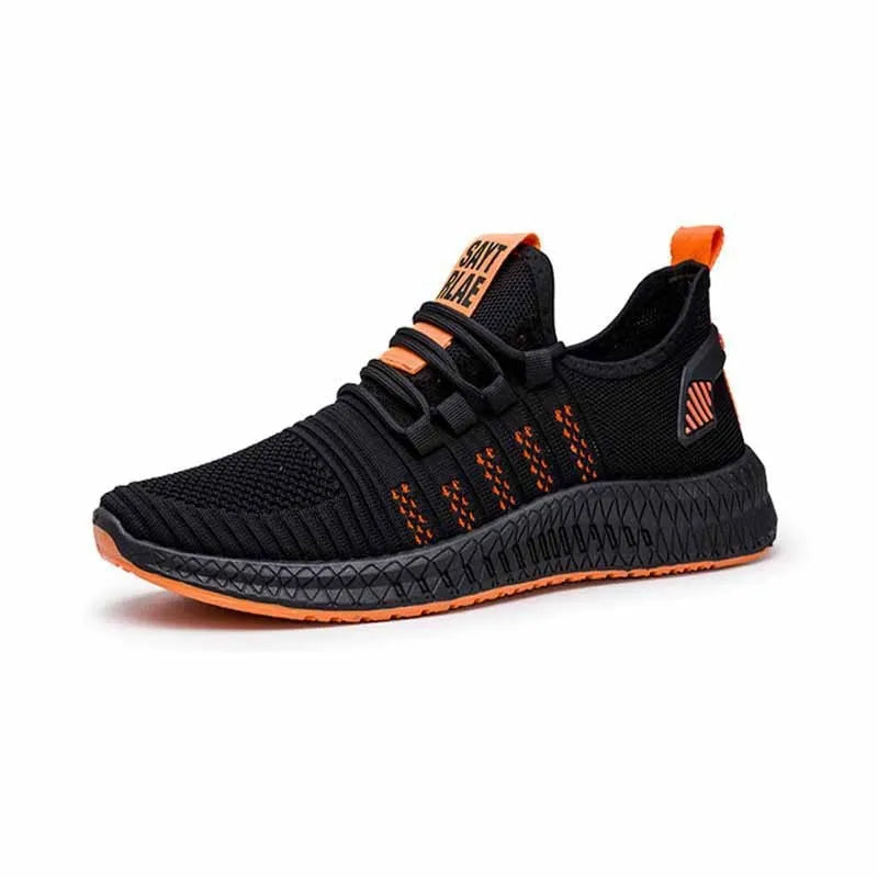 Men's black casual sneakers with flying weave upper, cross straps, and a low flat profile on a white background.