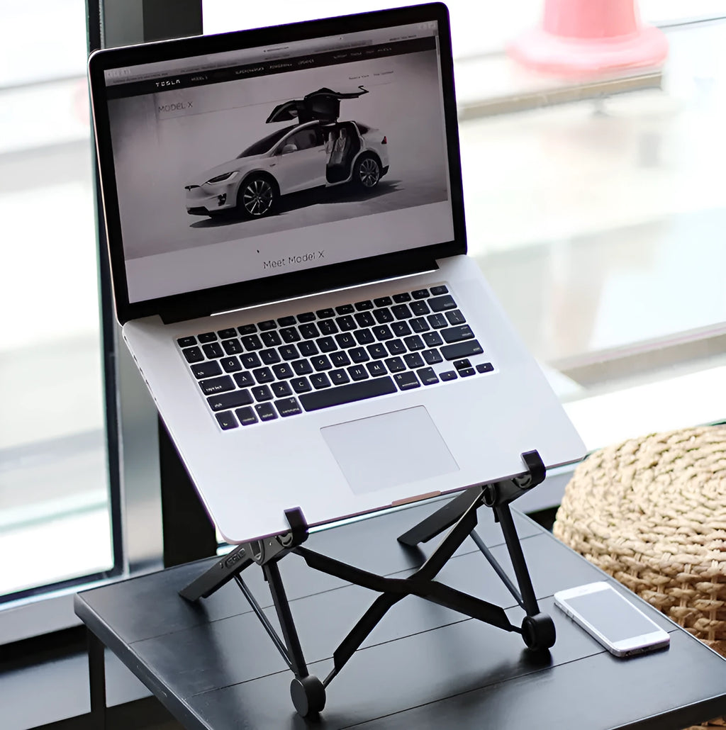 Black folding laptop stand with aluminium frame and reinforced nylon platform in extended position