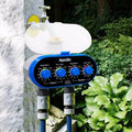 Dual timed irrigation controller with battery compartment and water connection ports