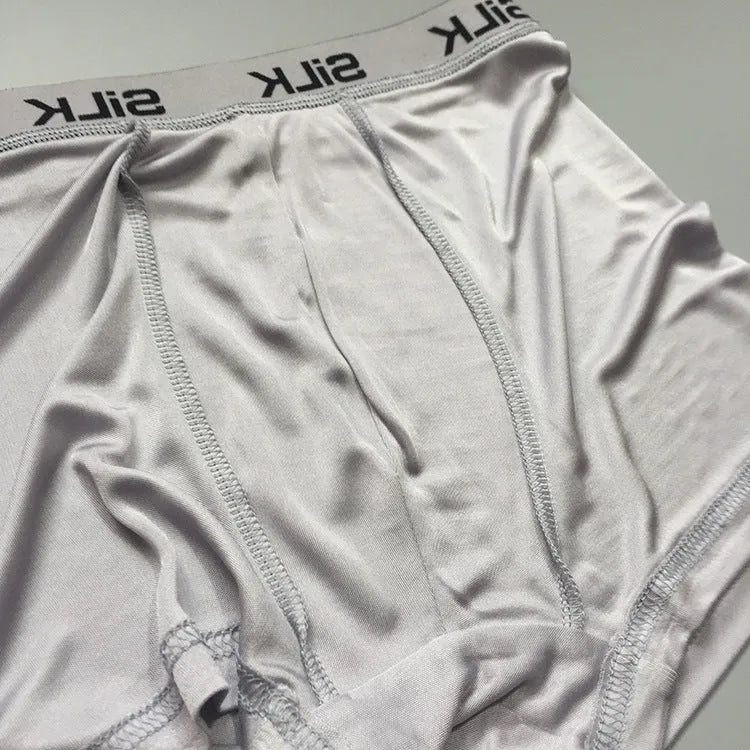 Men's navy blue silk shorts with mid-waist design on hanger