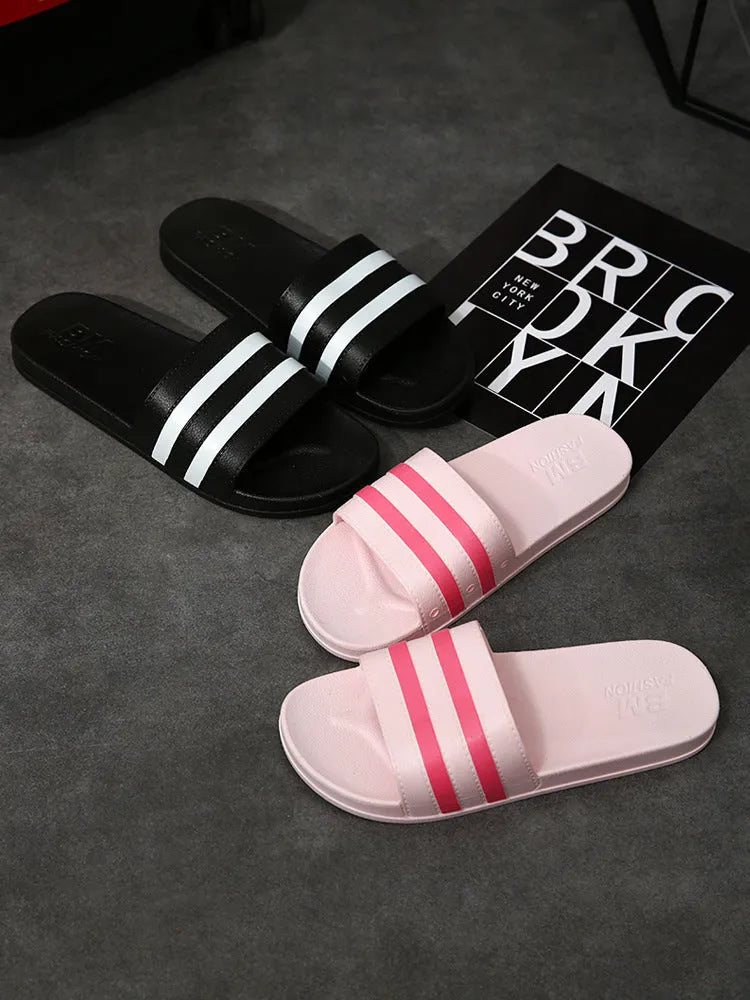 Striped PVC bath slippers in white, black, purple with injection-moulded sole, available in sizes 36-37 to 44-45