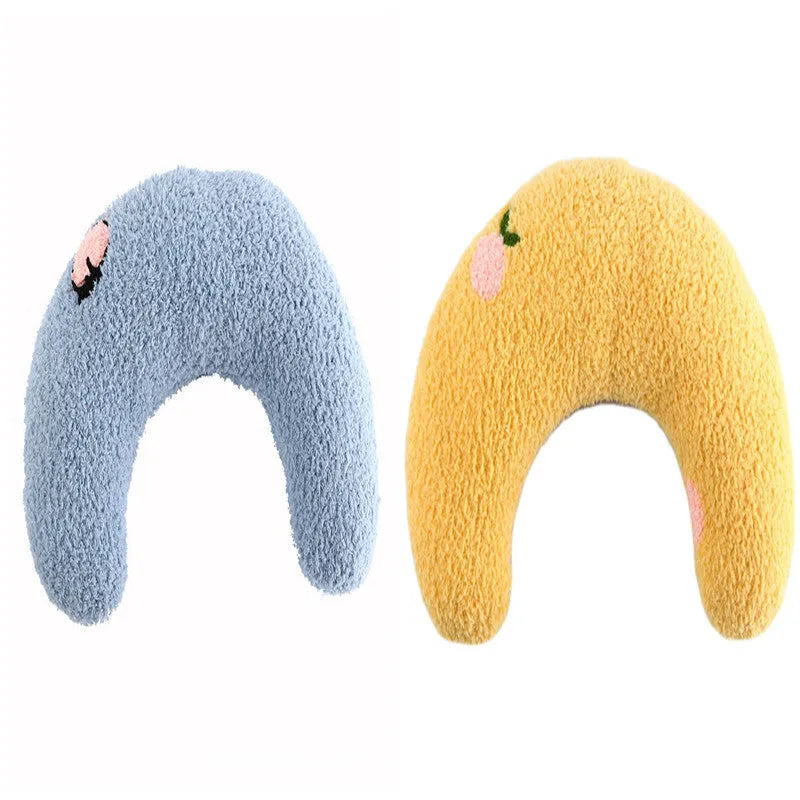 Blue U-shaped plush pet pillow for a small dog or cat, showing raised rim and quilted texture.