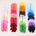 20 pairs of multicoloured 3-inch grosgrain ribbon pinwheel hair bows with alligator clips for baby girls.