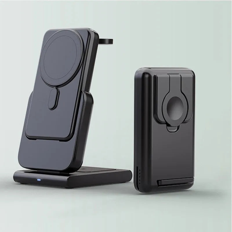 Black three-in-one magnetic power bank with folding stand charging iPhone 12, Apple Watch, and AirPods Pro wirelessly on a desk