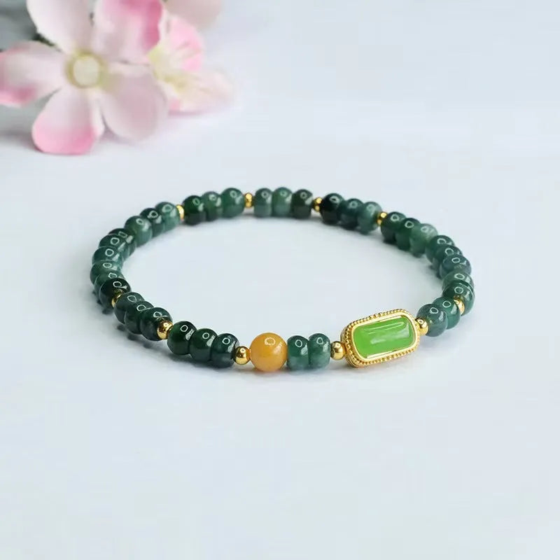 Close-up of a women's bracelet with blue water jade abacus beads in oval and round shapes on an adjustable band.