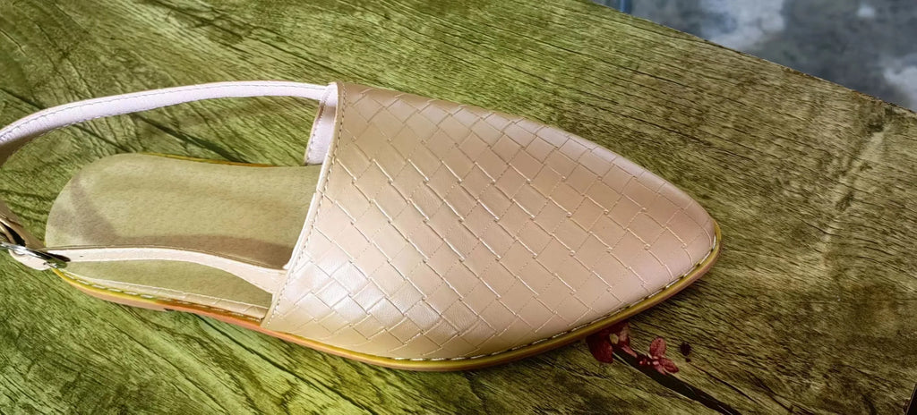 Women's black flat sandals with a pointed toe and metal buckle closure on a microfiber upper.