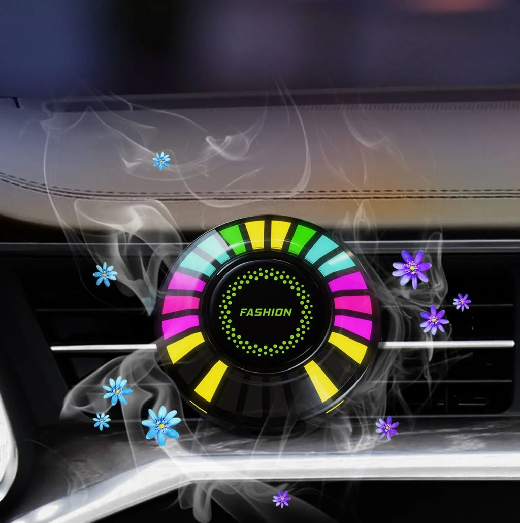 Car air vent mounted RGB atmosphere light with voice control and aromatherapy pod.