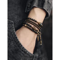 Black geometric beaded bracelet with multi-layered retro design