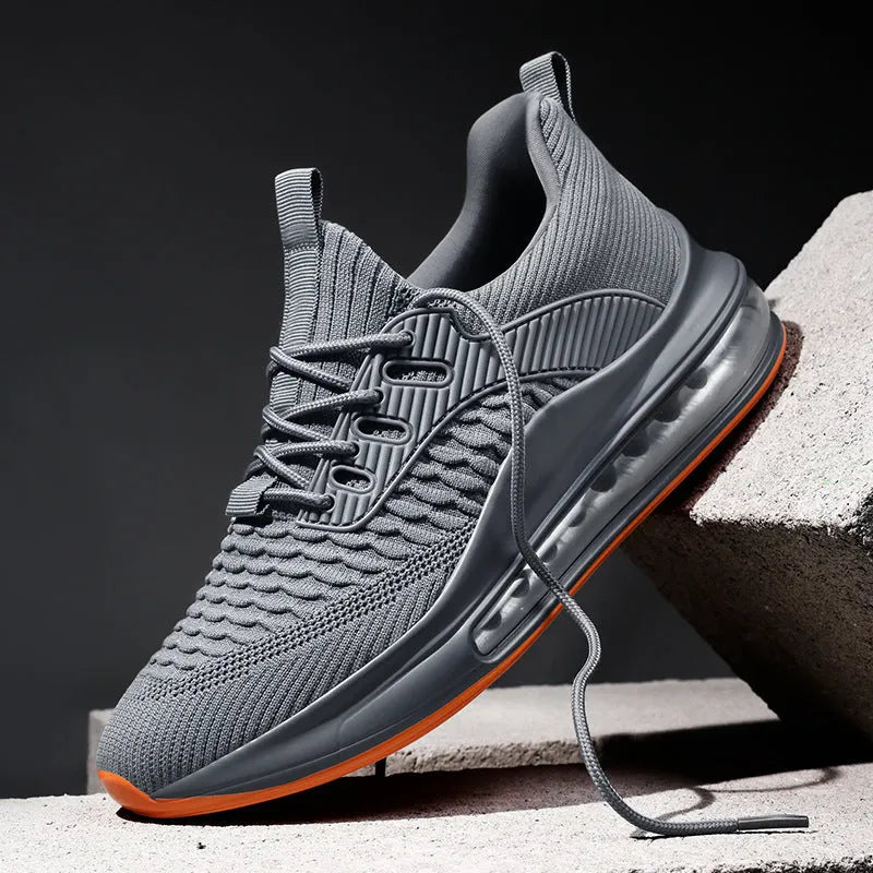 Men's black mesh running shoes with round toe and lace-up front, showing cushion damping sole