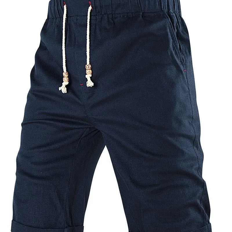 Men's solid-colour casual shorts with a drawstring waistband and a zipper pocket on the leg.