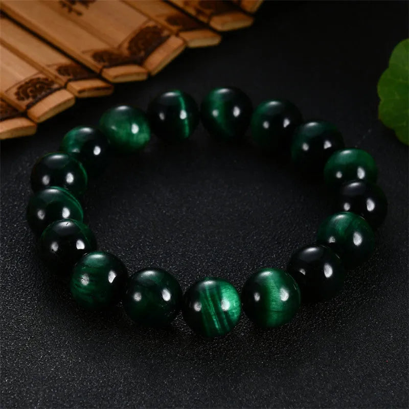 Natural green tiger eye stone bracelet with polished geometric beads in multiple sizes