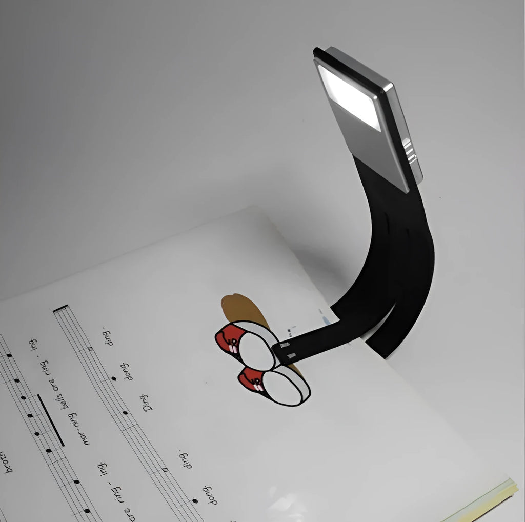 Black folding USB rechargeable LED reading light showing adjustable brightness settings