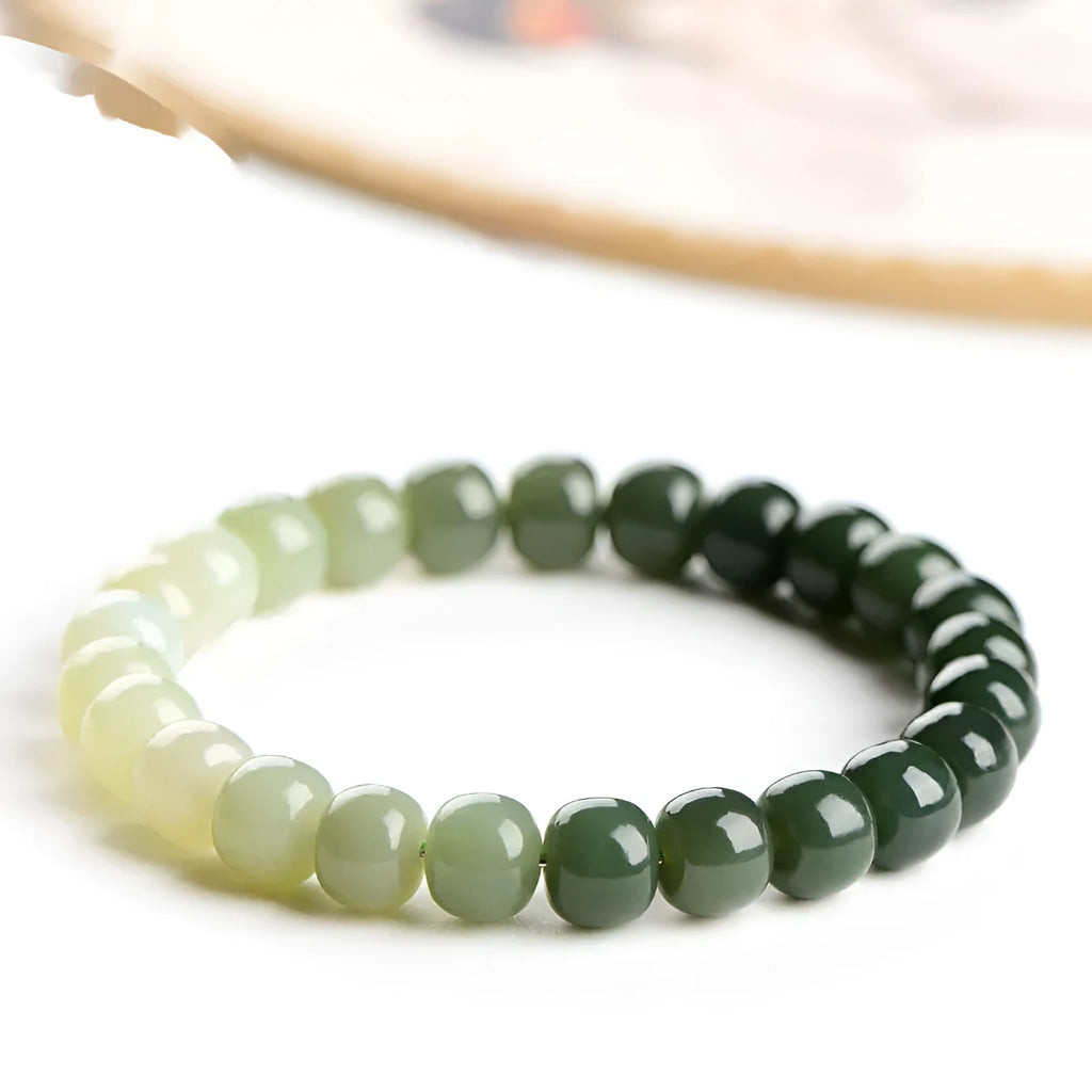 Natural Hetian jade bracelet with water gradient colour on polished beads, unisex casual style.