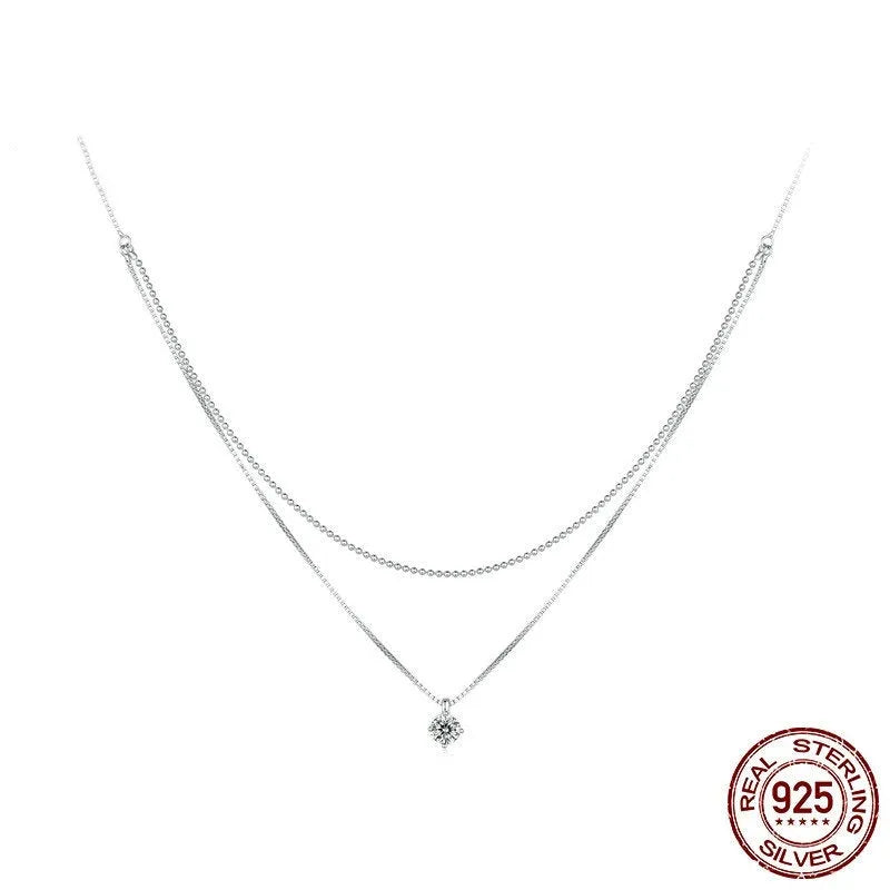 Close-up of a women's double-layer pearl chain necklace in S925 sterling silver with a shining pendant.