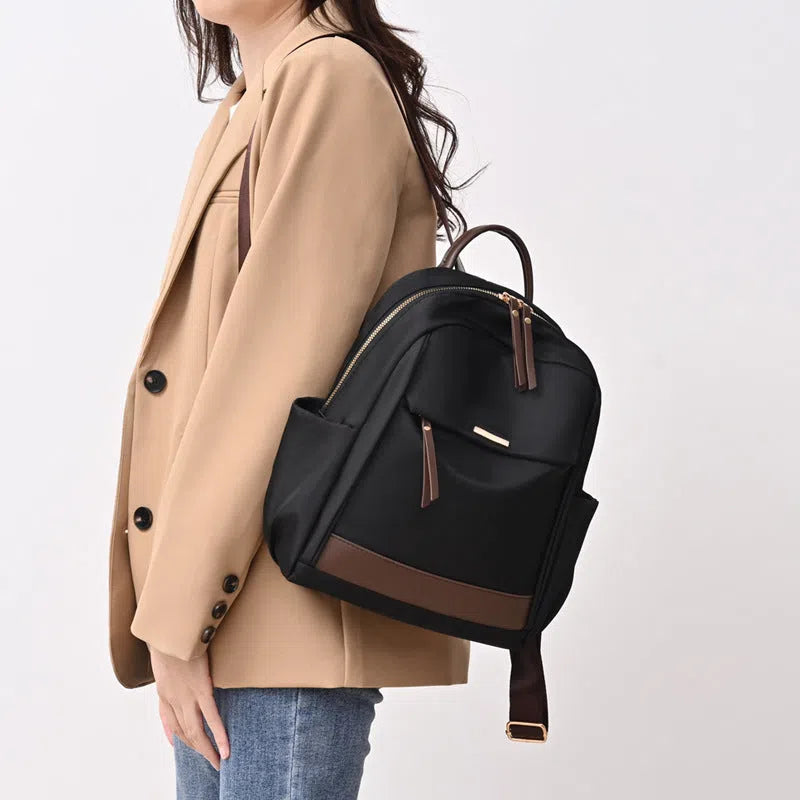 Women's large-capacity nylon travel backpack in black with internal patch pocket