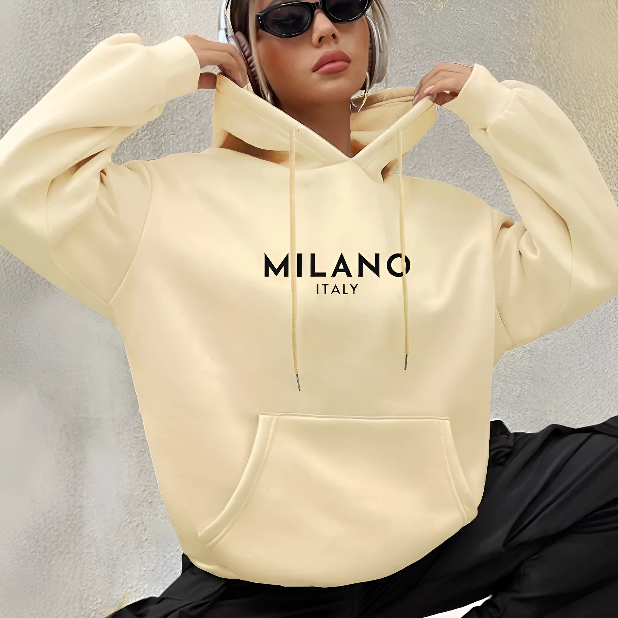 Casual long sleeved printed kangaroo pocket hoodie in black, loose fit, front view