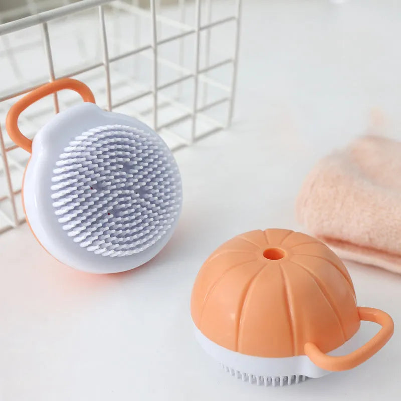 Orange TPR pet bath brush with shampoo dispenser and silicone bristles for dog and cat grooming