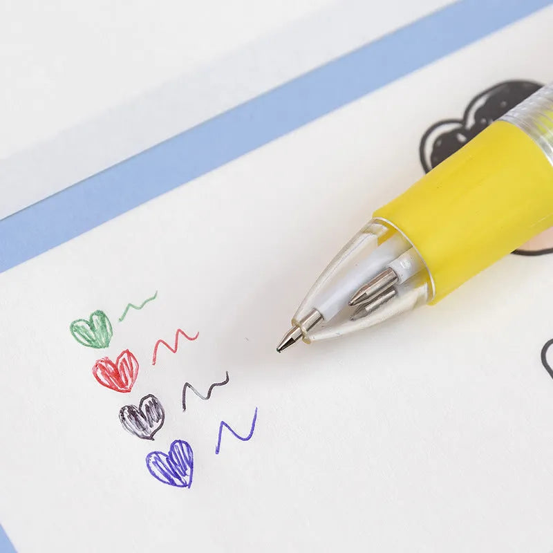 Cartoon character four colour press ballpoint pen with 0.7mm tip on a notepad.