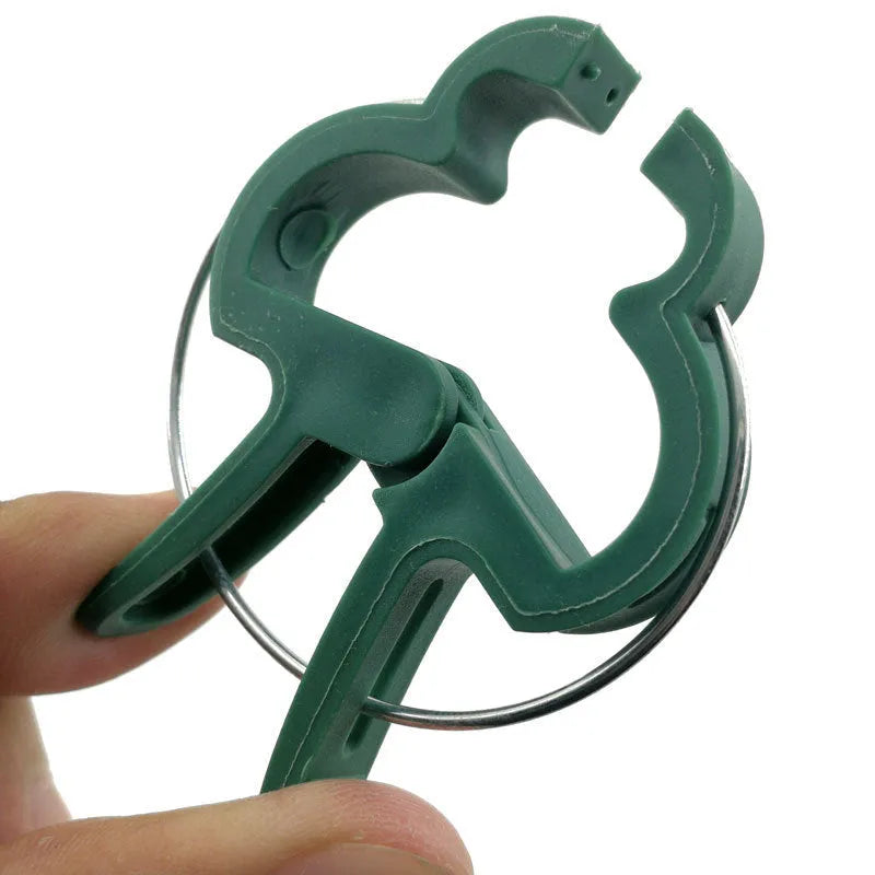 Green plastic and zinc plant support clips for climbing vegetables, showing large and small sizes.