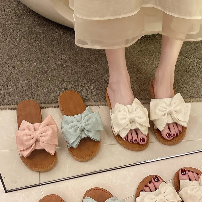 Women's slip-on cloth sandals with suede upper and decorative bow in beige colour