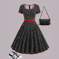 Multicolour polka dot dress with a square collar, short sleeves, pleated skirt, and a front zipper.