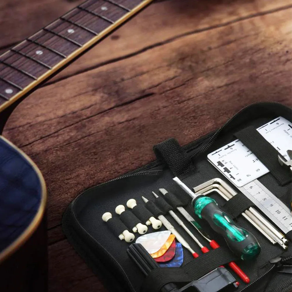 Black plastic case open to show metal guitar repair tools for maintenance
