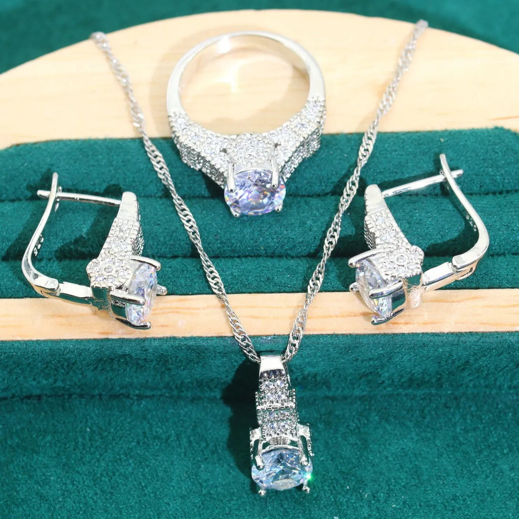 Bridal four-piece jewellery set showing necklace, earrings, ring and bracelet with water wave chain design