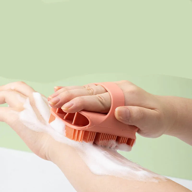 Blue silicone scalp massager shampoo brush with ergonomic handle and long bristles.