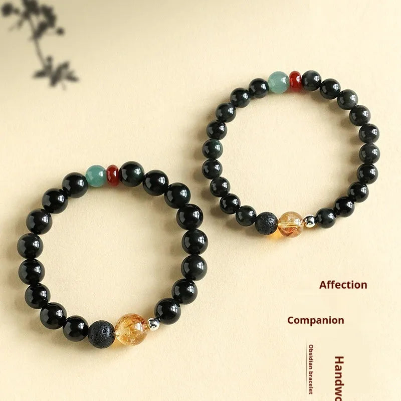 Chinese style obsidian yellow tower crystal and agate jade beaded bracelet shown in 8mm and 10mm bead sizes