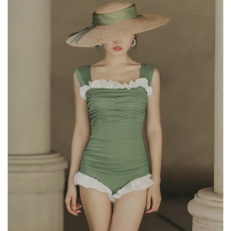 High-waist one-piece swimsuit in Korean style with slimming design available in black, pink, or green colours