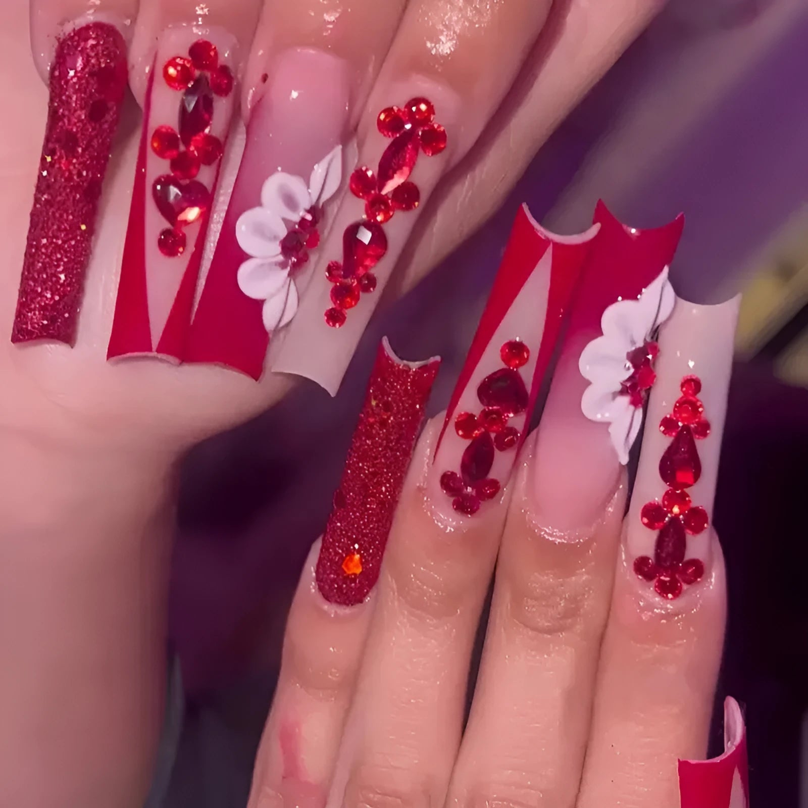 Sweet Flowers patterned fake nails with red diamonds in a long European square style.