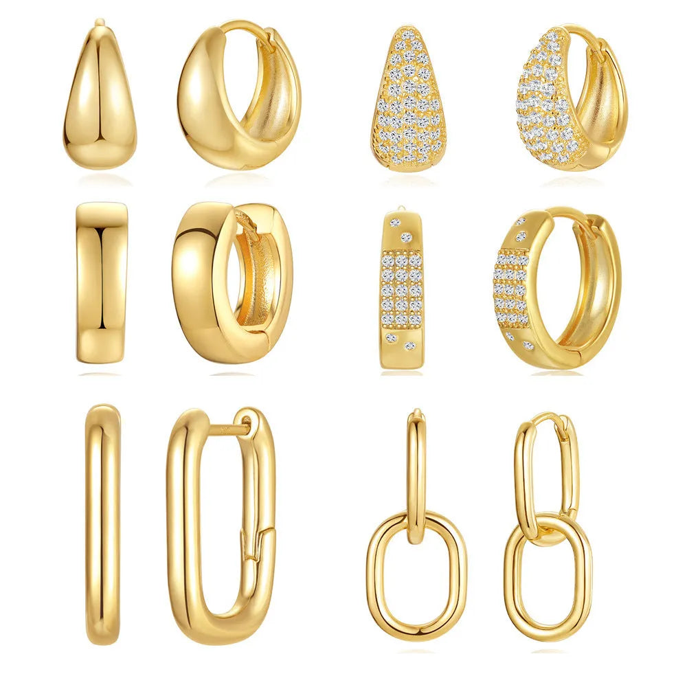 Geometric brass earclip earrings with a gold electroplated finish and round design details.