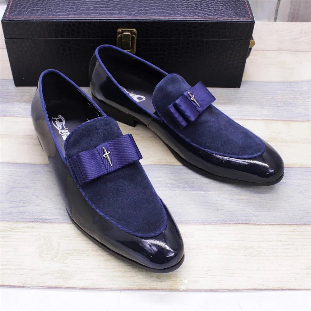Men's black low-top leather brogue shoes with a patent leather finish and tassel detail on a rubber sole.