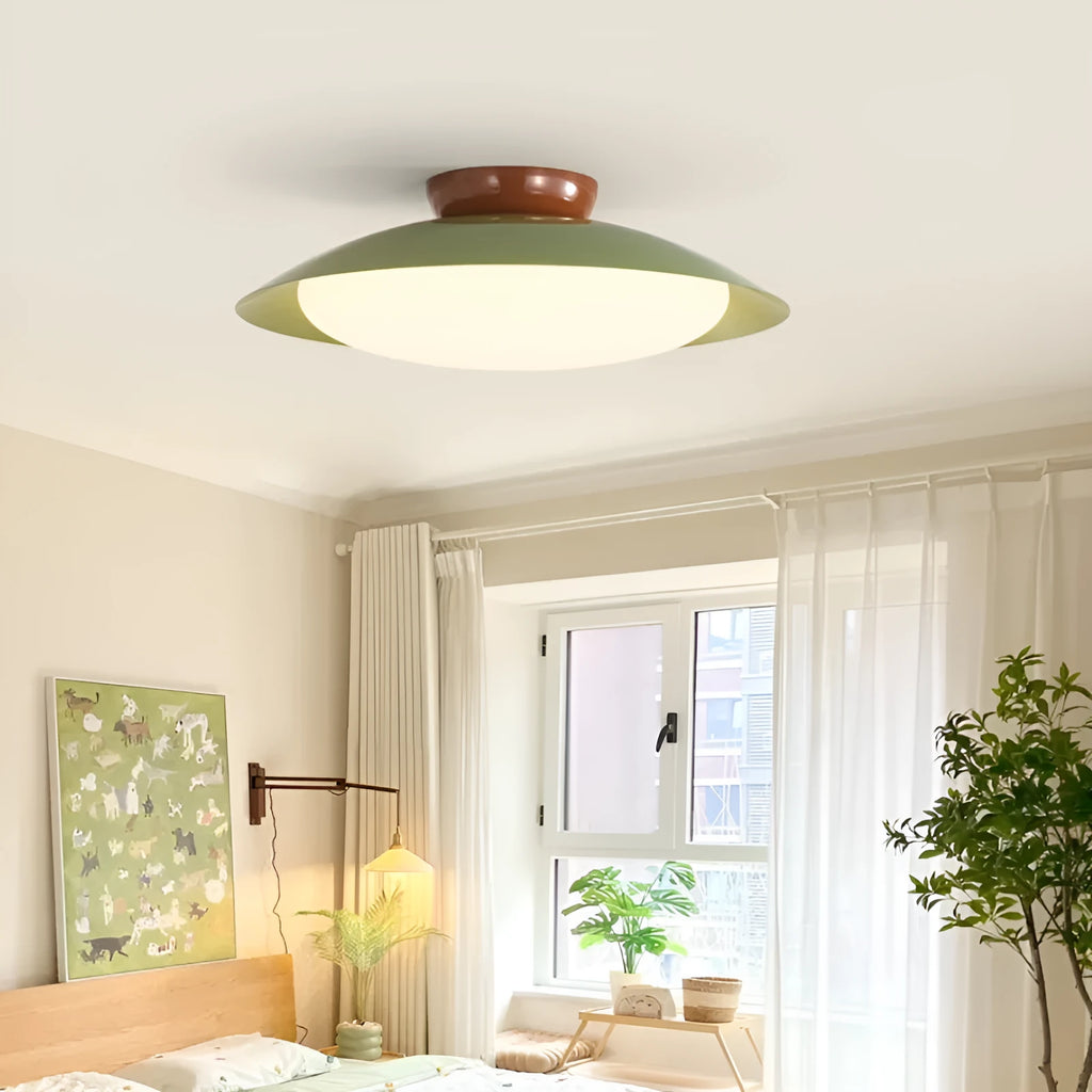 Modern cream-style flying saucer ceiling lamp in a minimalist room setting.