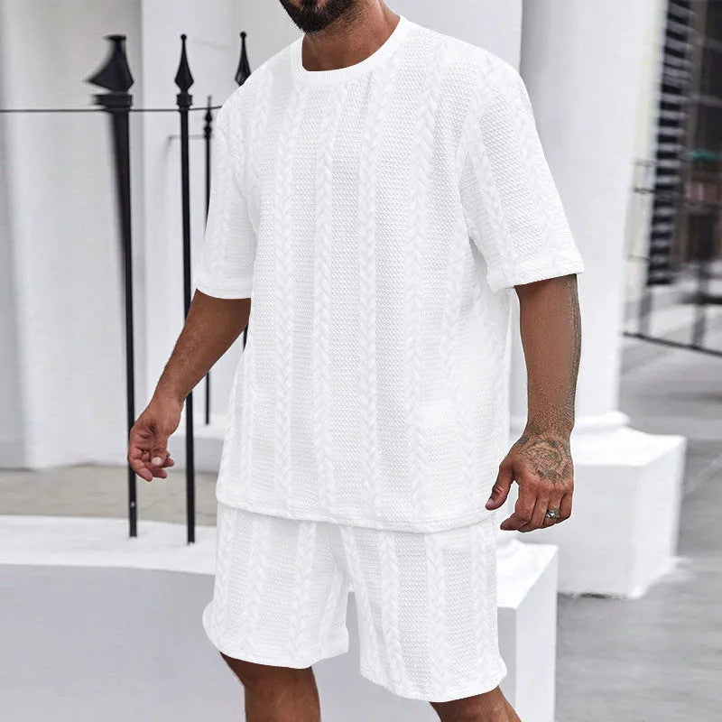 Knitted short sleeve pullover and matching shorts set in a solid colour with jacquard pattern.