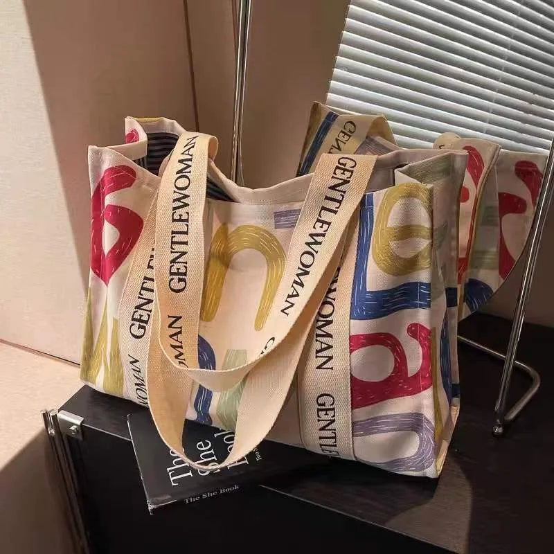 Large canvas tote bag with printed design options for travel and shopping