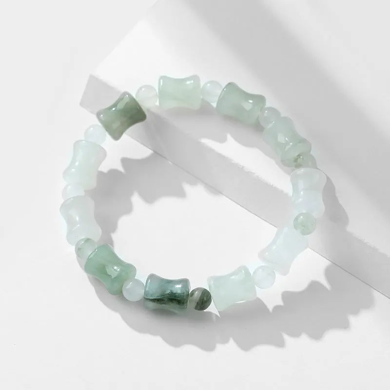 Korean style beaded bracelet with diamond shaped chalcedony and coconut shell beads on an elastic cord.