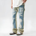 Retro yellow and blue patchwork splash-ink damaged design denim jeans on a mid-waist fit.