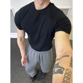 Men's slim fit knitted T-shirt with muscle-showing design and thread cuff-closing on short sleeves