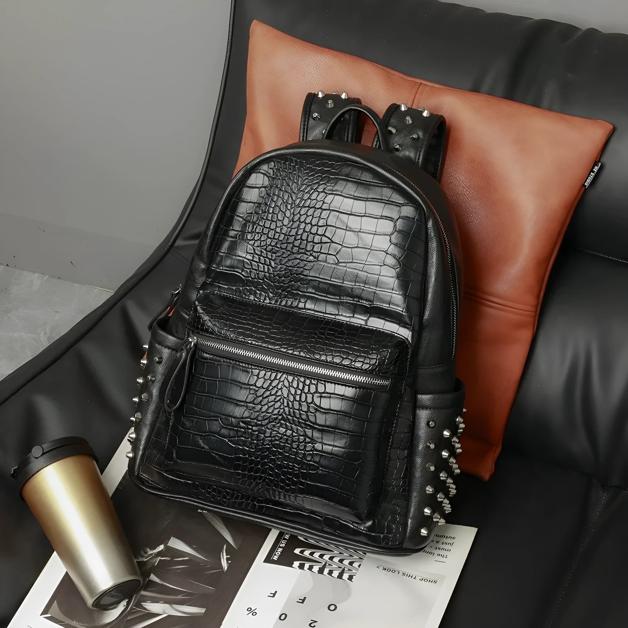 Black waterproof computer schoolbag with PU leather construction and 36-55 litre capacity