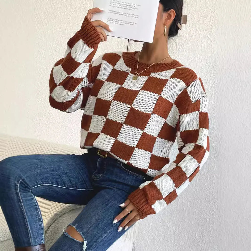 Dark brown loose pullover sweater with a chessboard plaid pattern and round neck.