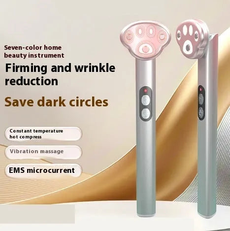 Cat's Paw design micro-current eye massager in gradient pink with LED light display.