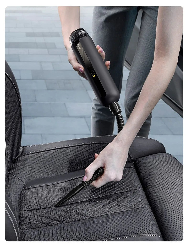 Baseus handheld cordless car vacuum cleaner in black, white, or green with blowing hose accessory.