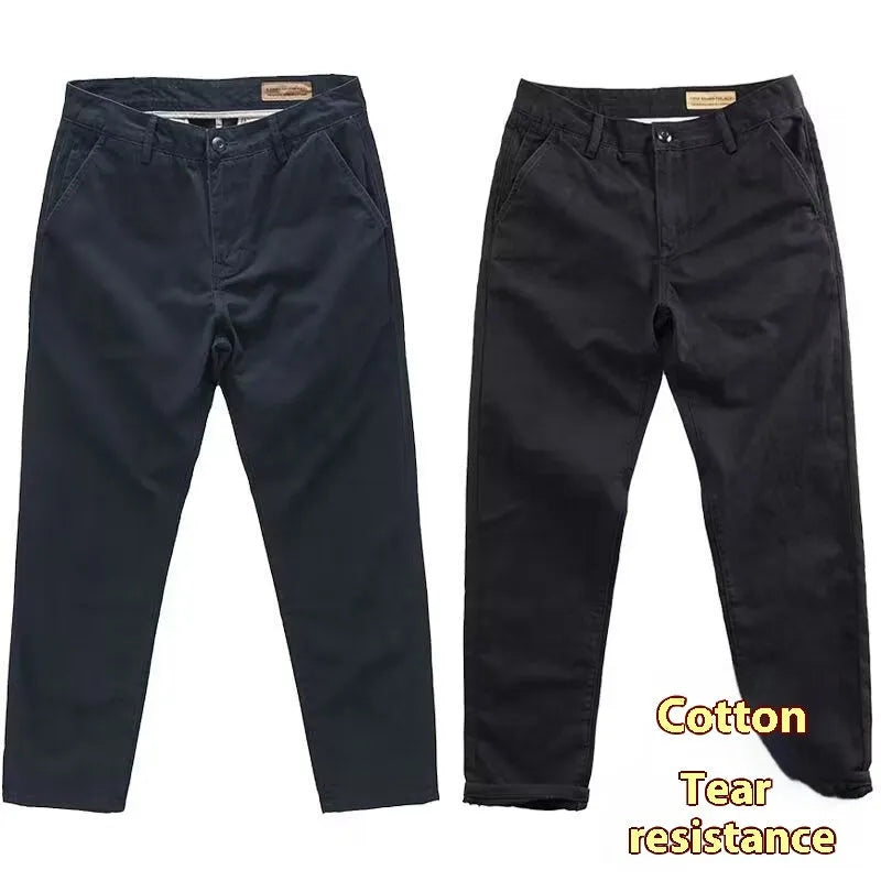 Man wearing slim fit straight-leg casual trousers in a grey washed fabric, showing business gentleman style.