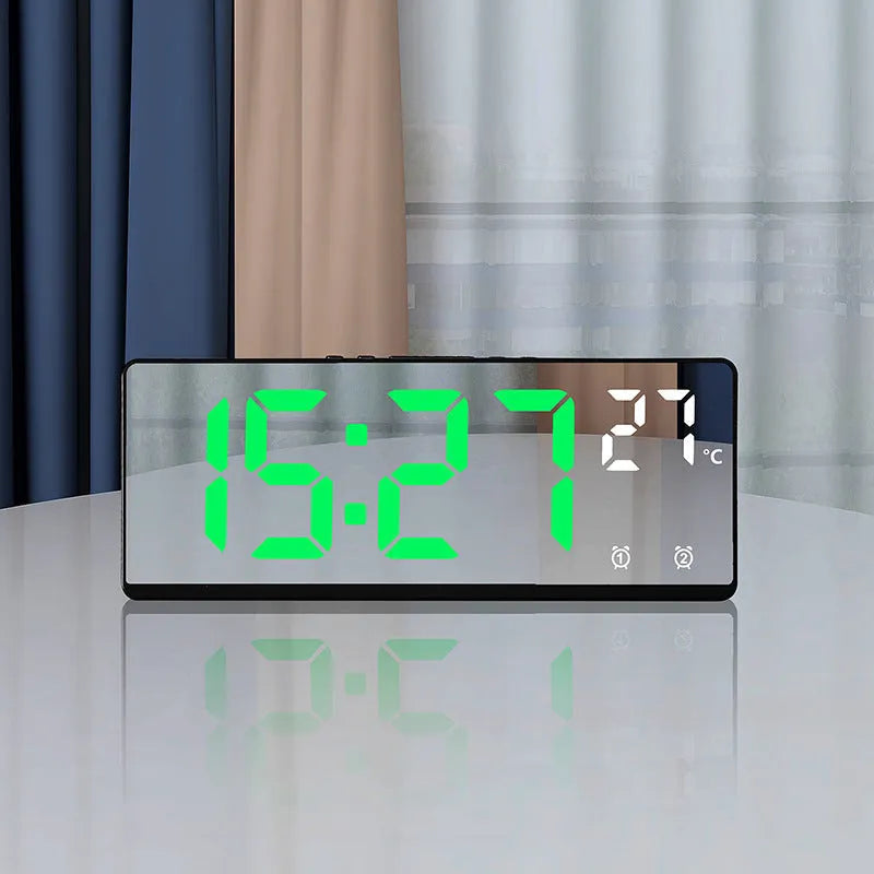Electronic LED alarm clock with large digital display showing time and temperature, in acrylic blue and white colour.